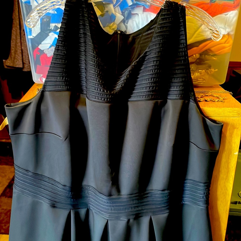 Black dress with ribbed black details. Sturdy.